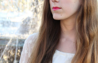 woman with long hair in a white top